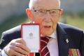 Captain Sir Tom Moore knighted
